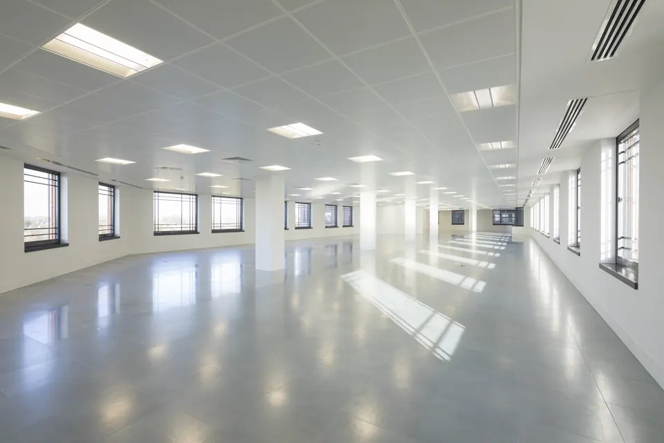 Open-plan CAT A office floor with continuous windows